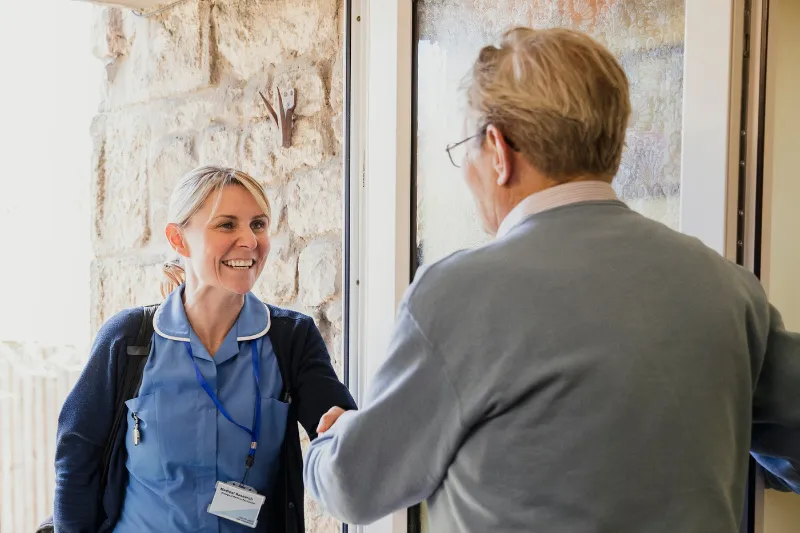 Carer helping an elderly person - Visiting Care
