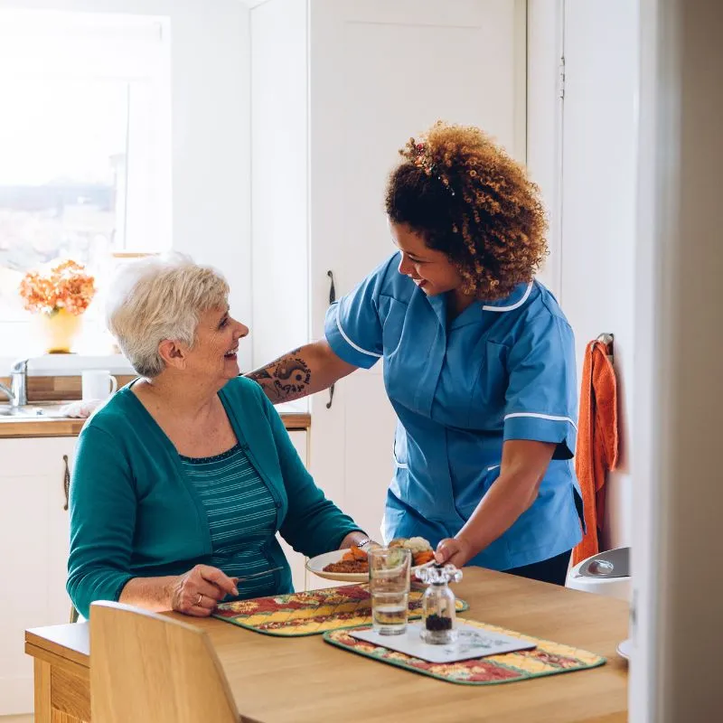Carer serving food - Live-in care